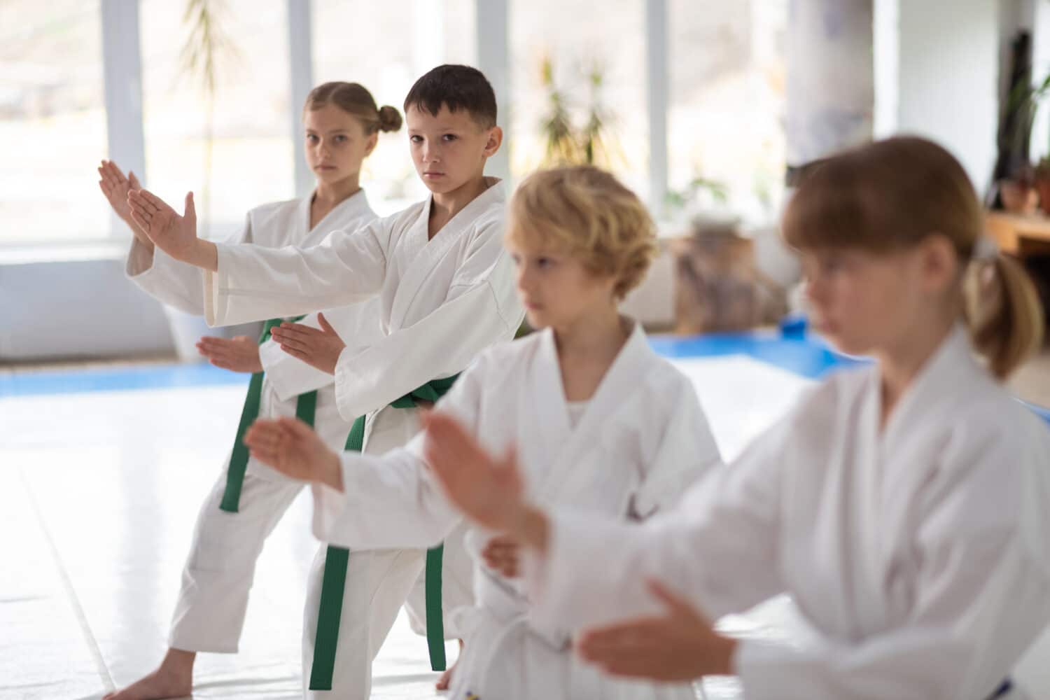 Kids practicing forms in a children's martial arts class